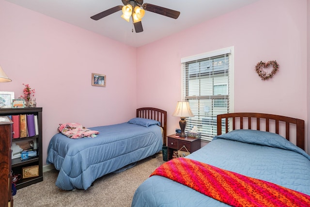 bedroom with ceiling fan and carpet