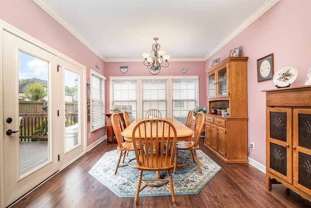 dining space with dark hardwood / wood-style flooring, crown molding, and an inviting chandelier