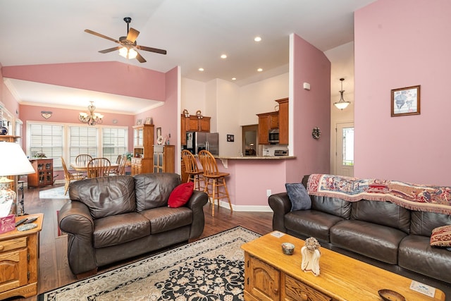 living room featuring hardwood / wood-style floors, ceiling fan with notable chandelier, a wealth of natural light, and lofted ceiling