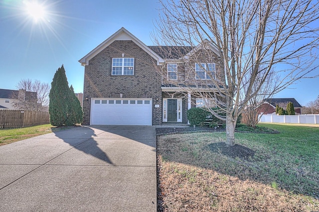 view of front of property with a front lawn and a garage