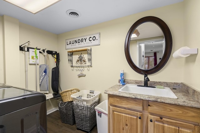 bathroom featuring hardwood / wood-style floors and vanity