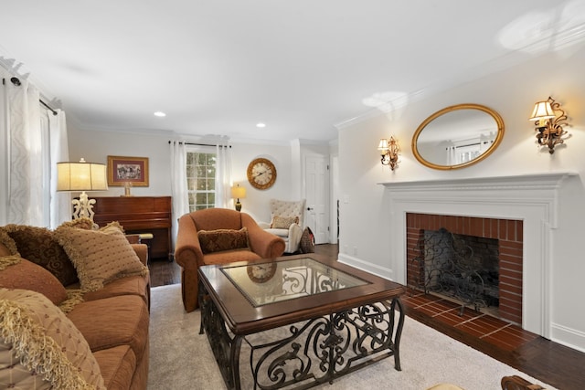 living room featuring hardwood / wood-style flooring, a brick fireplace, and crown molding