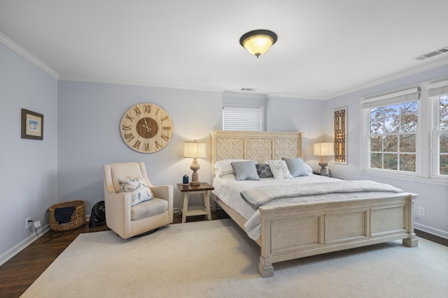 bedroom featuring hardwood / wood-style flooring and ornamental molding