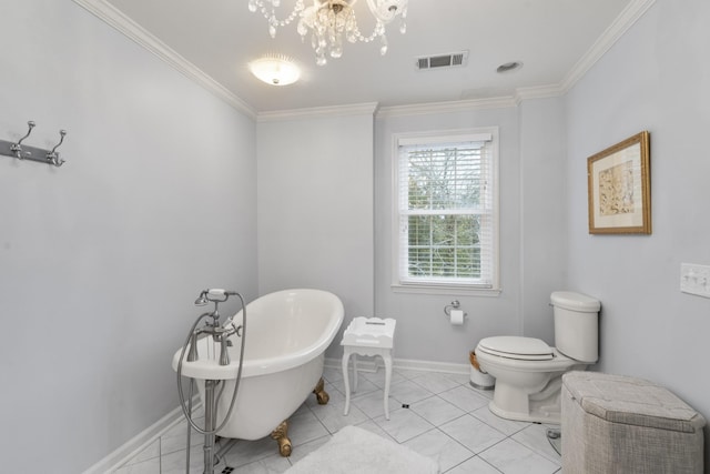 bathroom with a bathtub, tile patterned floors, toilet, ornamental molding, and a chandelier