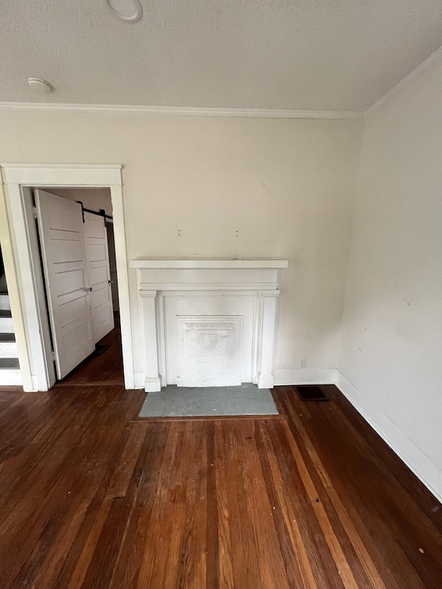 interior details with crown molding, a textured ceiling, baseboards, and wood finished floors