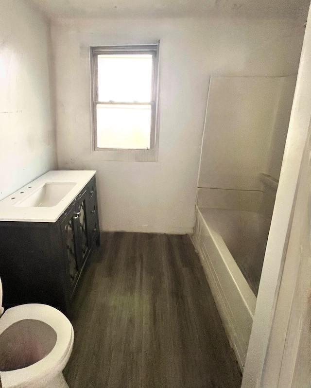 full bath with wood finished floors and vanity