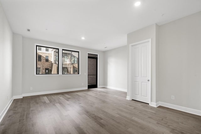 empty room featuring wood-type flooring