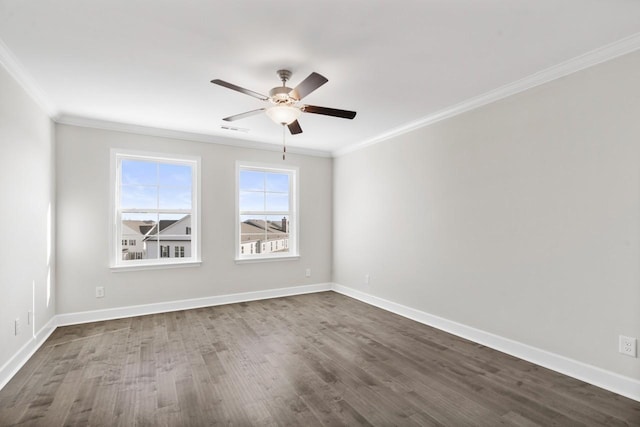 empty room featuring ceiling fan, ornamental molding, and dark wood-type flooring