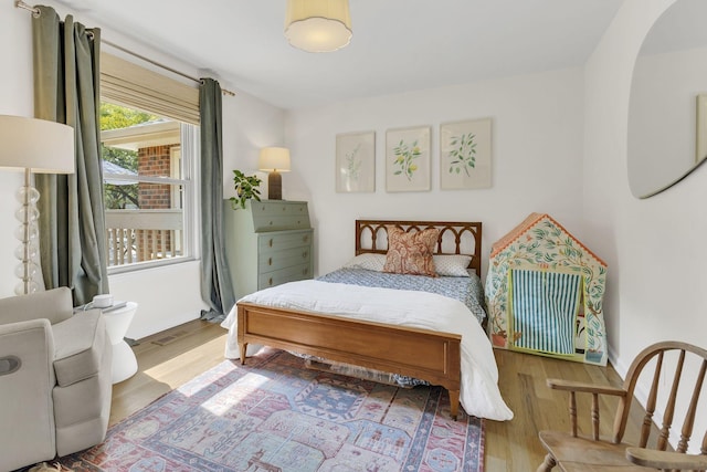 bedroom featuring wood-type flooring