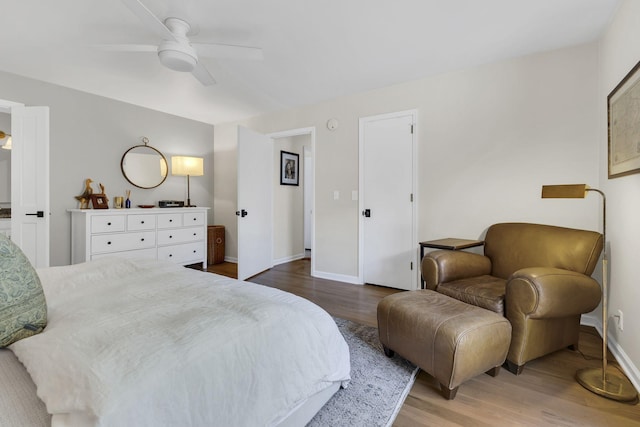 bedroom with ceiling fan and hardwood / wood-style floors