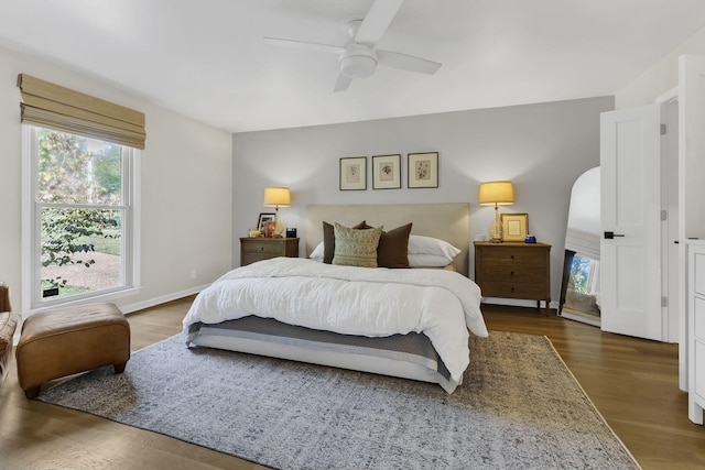 bedroom featuring ceiling fan and dark wood-type flooring