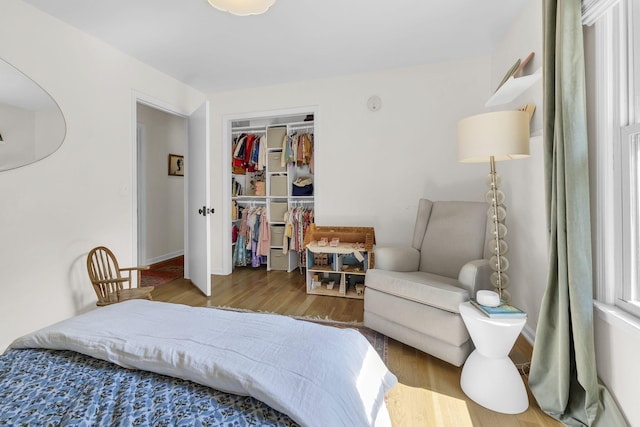 bedroom featuring a closet and hardwood / wood-style flooring