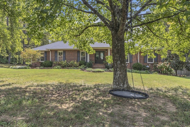 ranch-style house featuring a front lawn