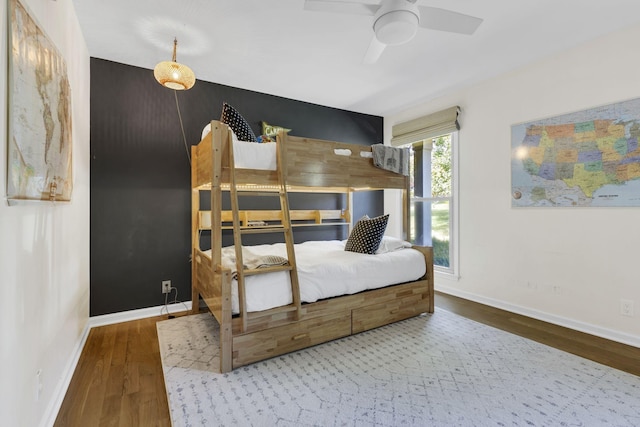 bedroom featuring hardwood / wood-style floors and ceiling fan