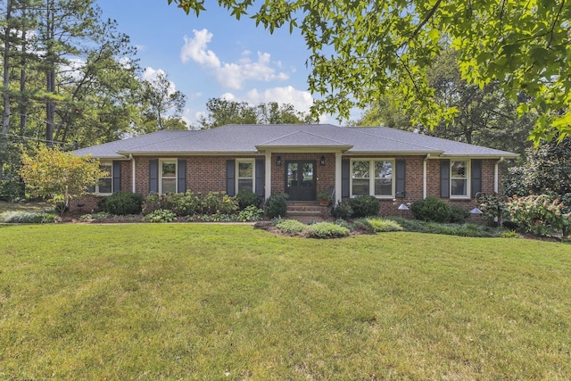 single story home featuring a front yard