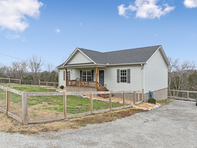 view of front of house with a front yard and a porch