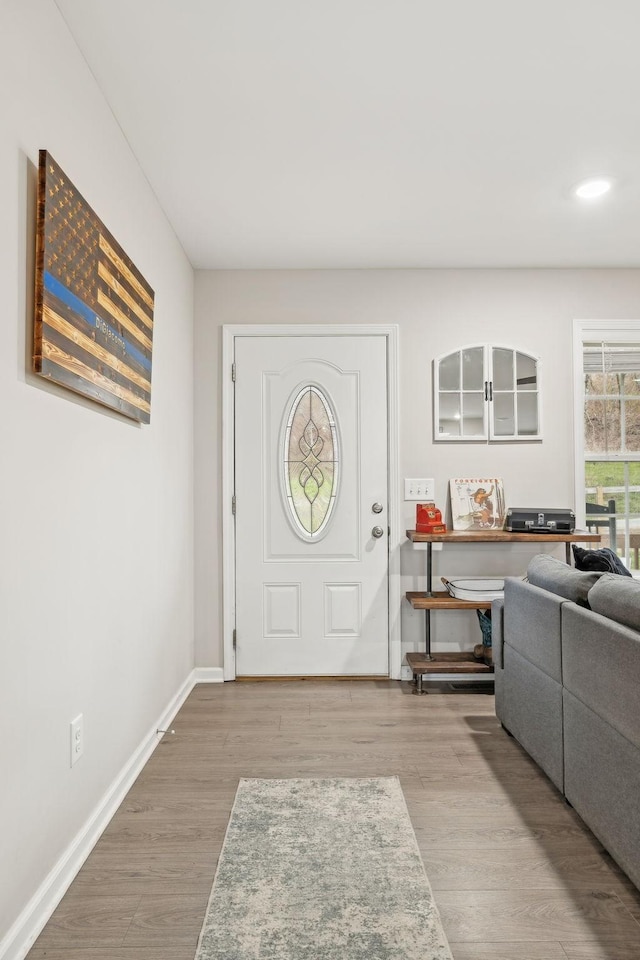 foyer entrance with light hardwood / wood-style floors