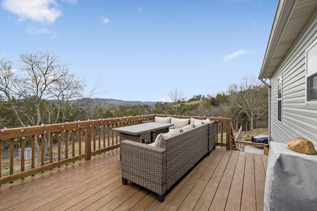 wooden terrace featuring an outdoor living space