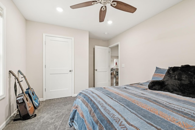 bedroom with ceiling fan and carpet floors