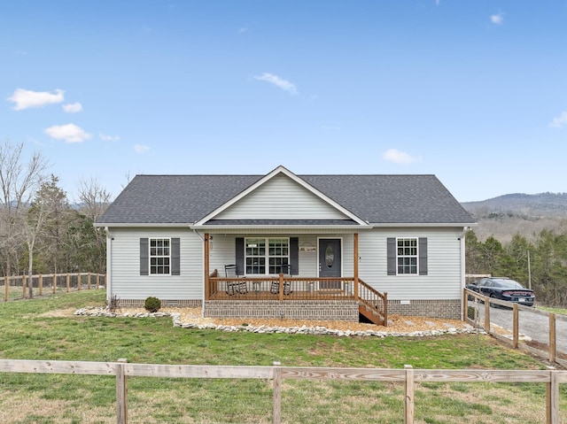 single story home with covered porch and a front yard