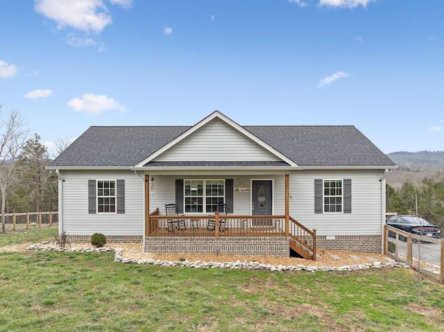 ranch-style home featuring a front lawn and a porch