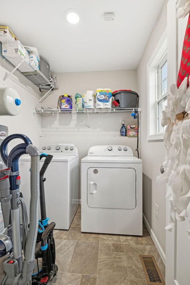 washroom featuring washer and clothes dryer