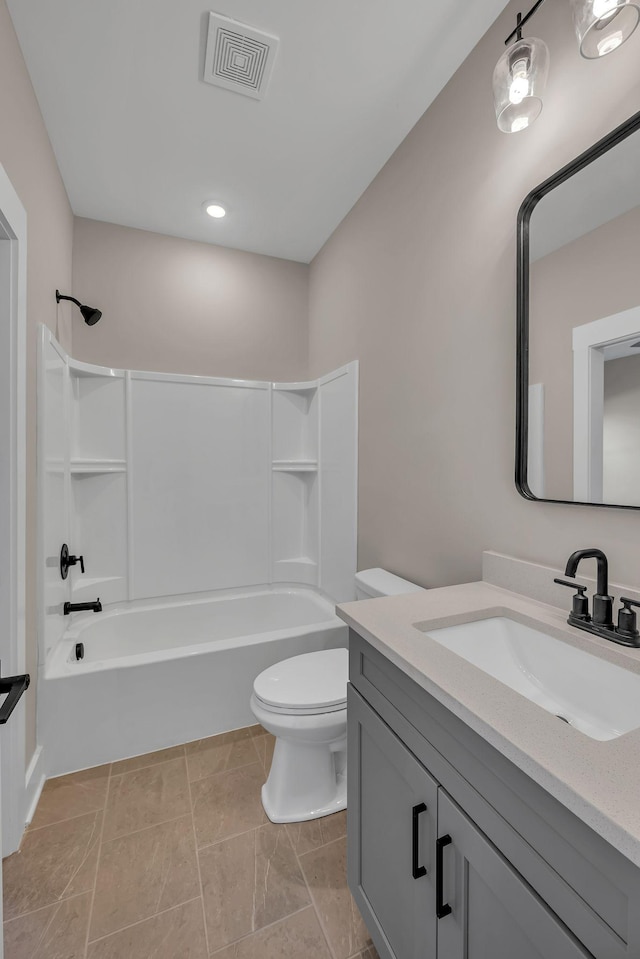 full bathroom featuring shower / bathing tub combination, vanity, toilet, and tile patterned floors