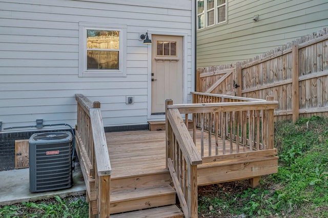 wooden deck with central air condition unit