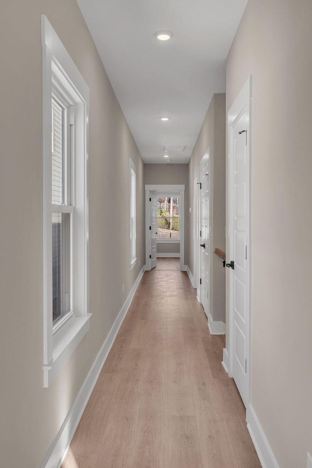 hallway with light wood-type flooring