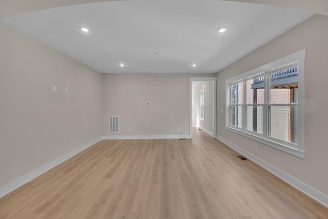 unfurnished room with light hardwood / wood-style flooring