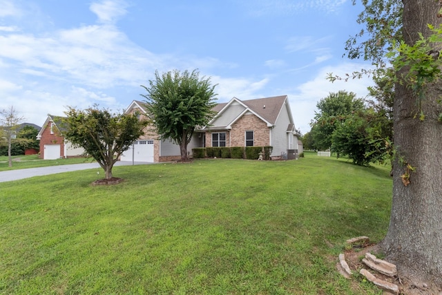 view of front of house with a front yard and a garage