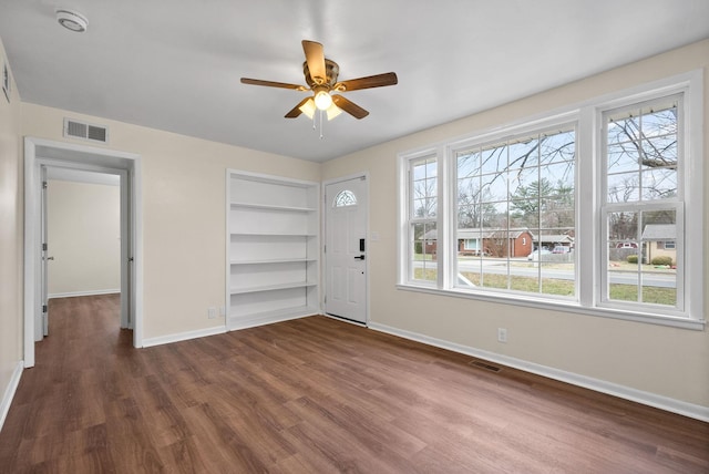 foyer featuring ceiling fan and dark hardwood / wood-style floors