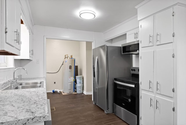 kitchen with appliances with stainless steel finishes, electric water heater, dark wood-type flooring, sink, and white cabinets