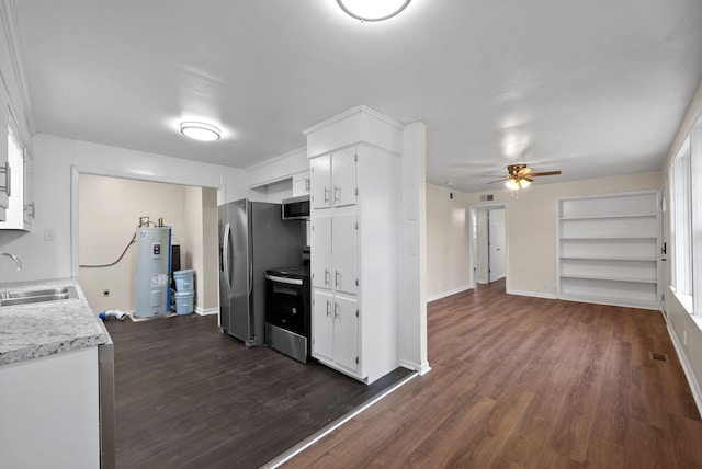 kitchen featuring white cabinets, sink, built in shelves, appliances with stainless steel finishes, and water heater