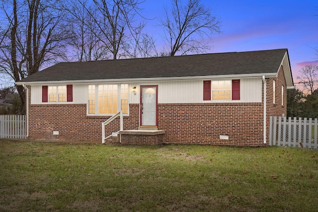 view of front of home with a yard