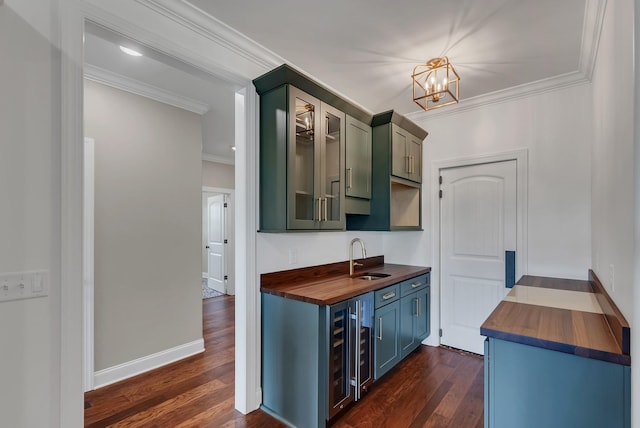 kitchen featuring dark wood-type flooring, sink, beverage cooler, and butcher block counters