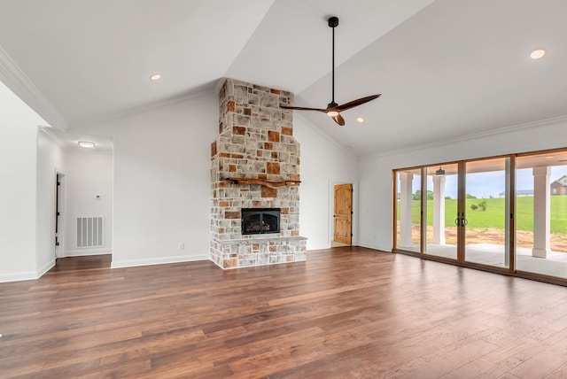 unfurnished living room featuring a stone fireplace, hardwood / wood-style flooring, high vaulted ceiling, ceiling fan, and crown molding