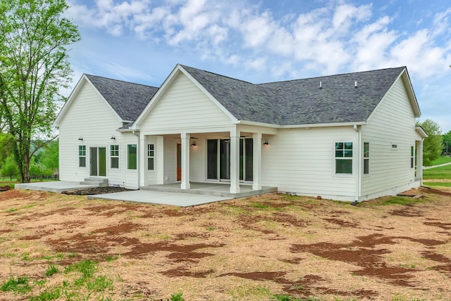 back of property featuring a patio