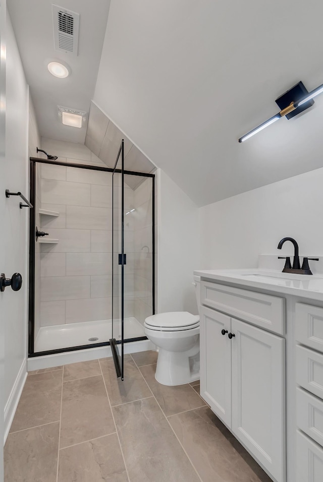 bathroom featuring toilet, a shower with door, lofted ceiling, and vanity