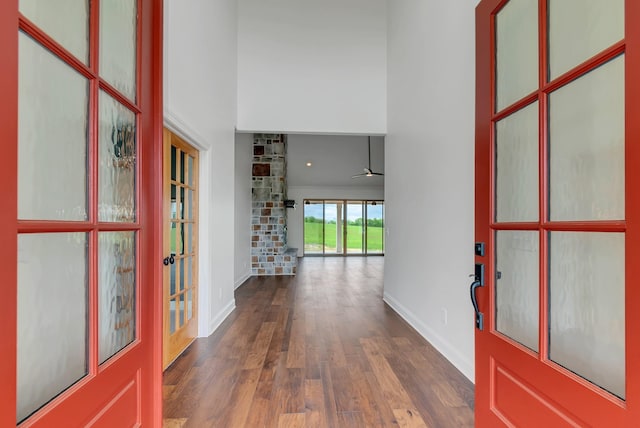 entryway featuring dark wood-type flooring, ceiling fan, and french doors