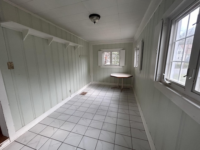 unfurnished sunroom with a wealth of natural light