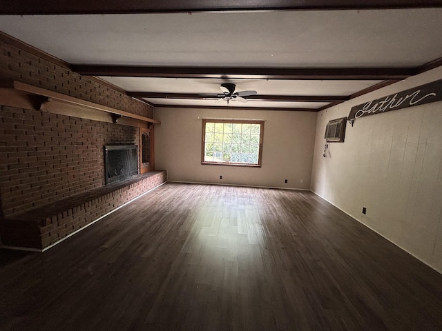 unfurnished living room featuring a wall mounted air conditioner, a brick fireplace, ceiling fan, beam ceiling, and wood-type flooring