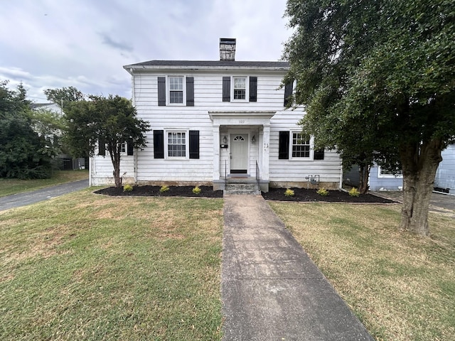 colonial home with a front yard