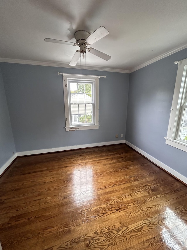 unfurnished room with ceiling fan, dark hardwood / wood-style flooring, and crown molding