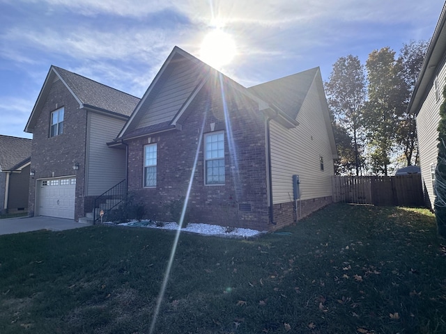 view of front of house featuring a garage and a front lawn