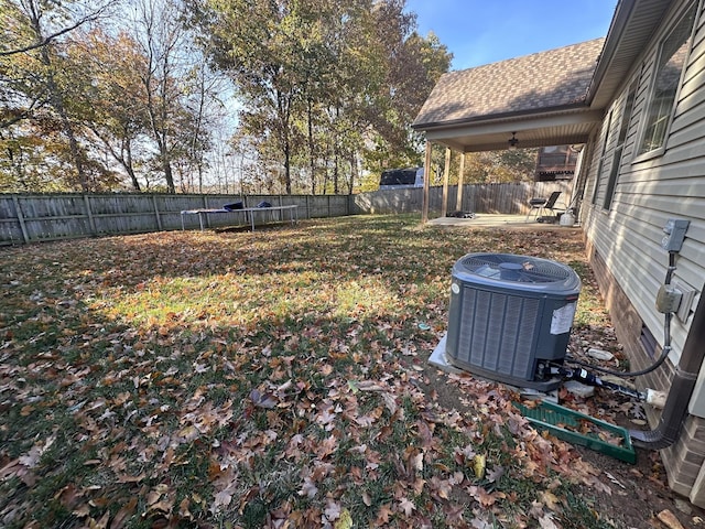 view of yard with central air condition unit