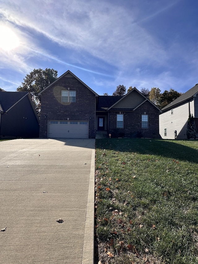 view of front of property with a garage and a front lawn