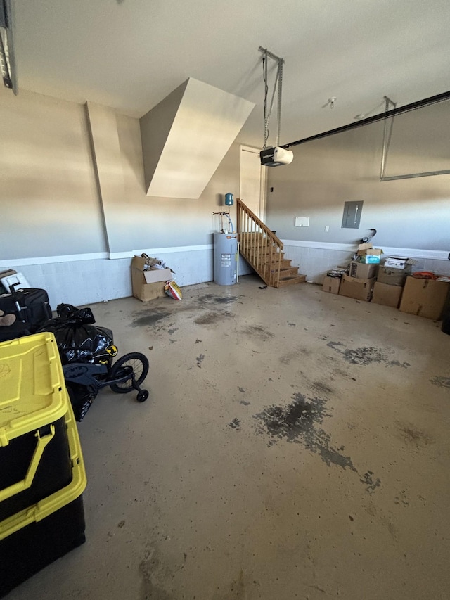 garage featuring water heater and a garage door opener