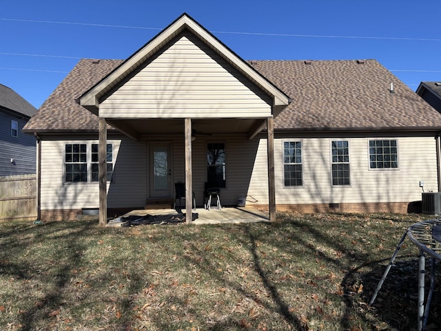 back of property featuring a patio area, central AC, and a yard