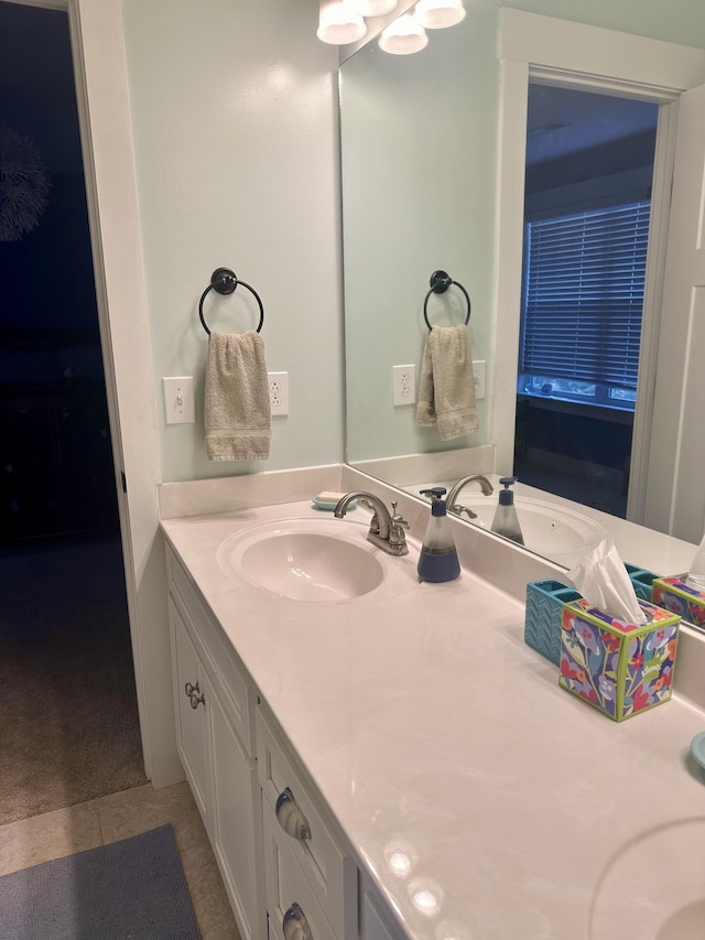 bathroom featuring tile patterned flooring and vanity